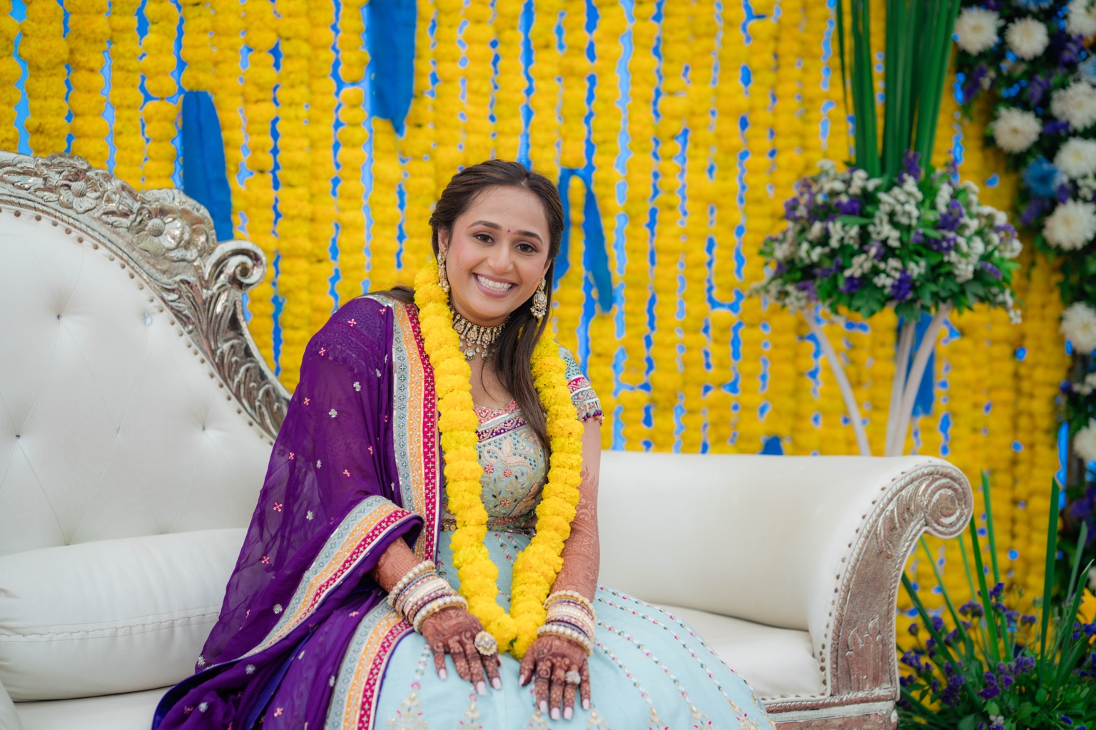 Riddhi smiling in a traditional outfit